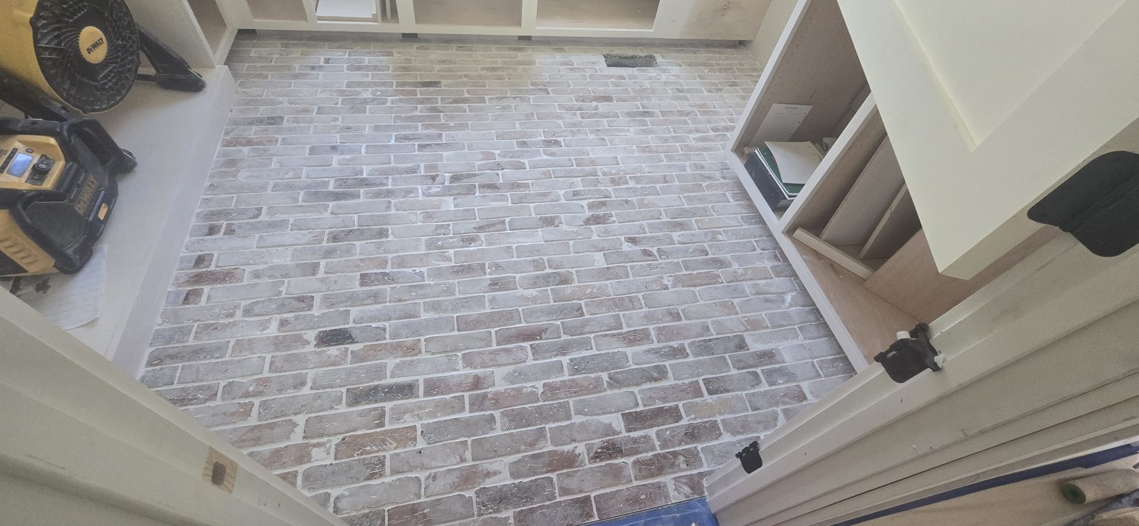 Brick-look porcelain tile floor installation