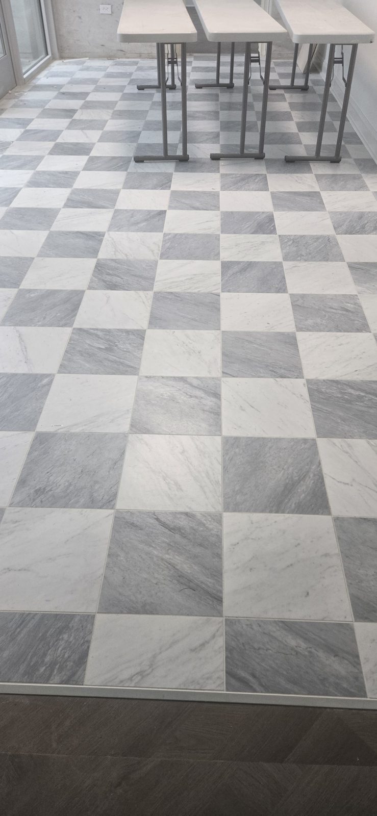 Checkerboard marble-look porcelain tile floor